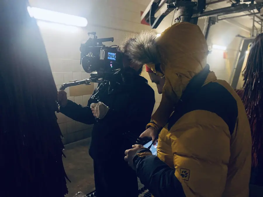 Camera operator in a dark studio