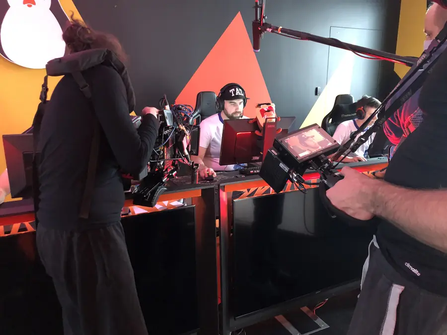 Esports set with a camera operator and monitor
