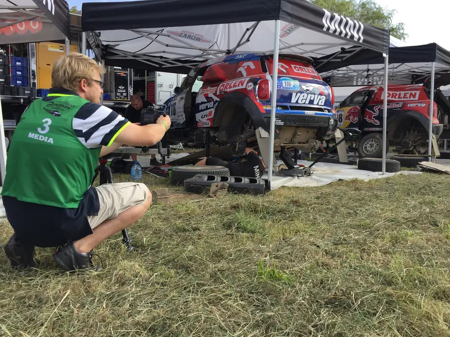 Crew by a rally car