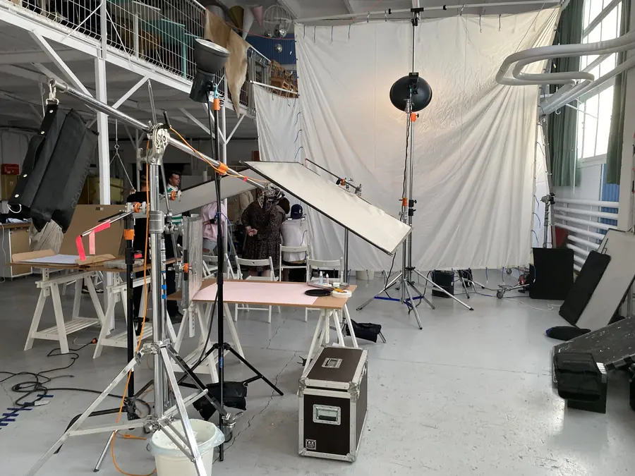 Studio with reflectors and a white backdrop