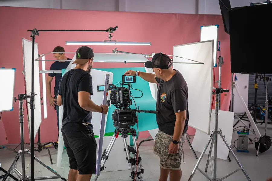 Camera operators on a colourful set