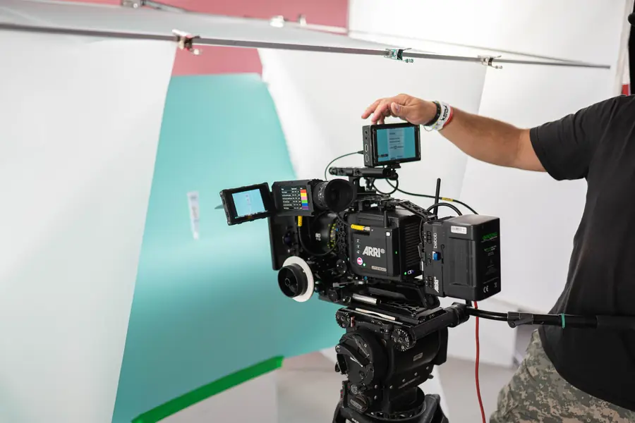 Cinema camera on a turquoise set